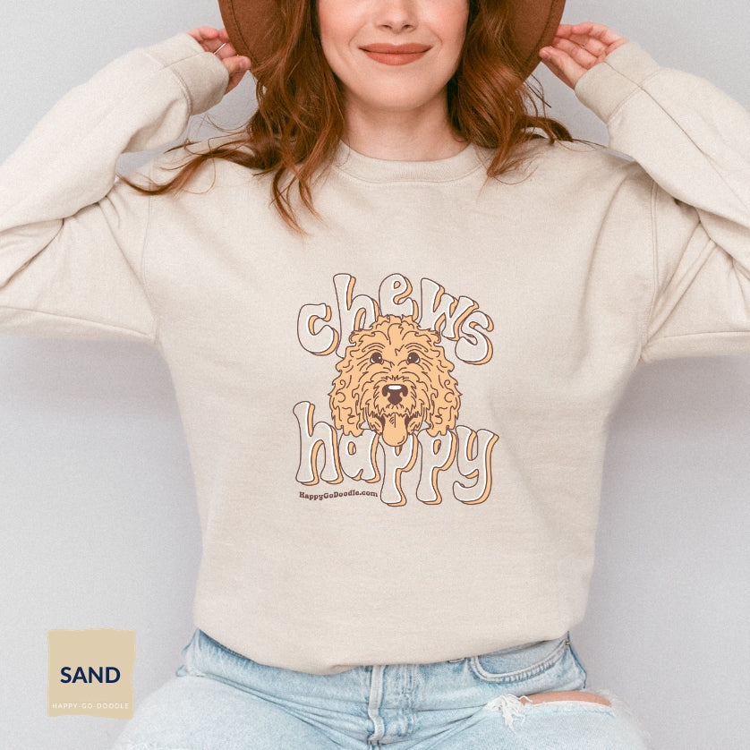 Goldendoodle crew neck sweatshirt with Goldendoodle face and words "Chews Happy" in sand color