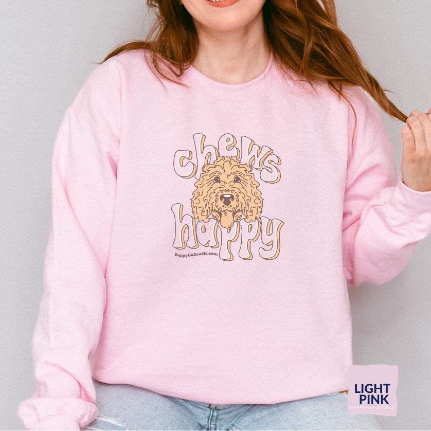 Goldendoodle crew neck sweatshirt with Goldendoodle face and words "Chews Happy" in light pink color
