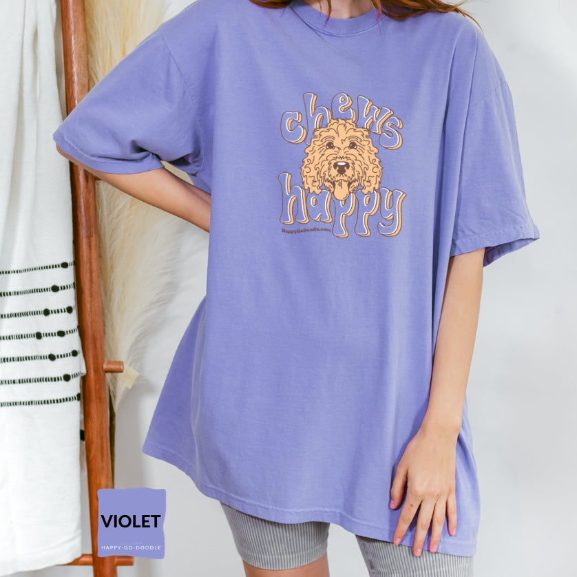 Goldendoodle comfort colors t-shirt with Goldendoodle face and words "Chews Happy" in violet color