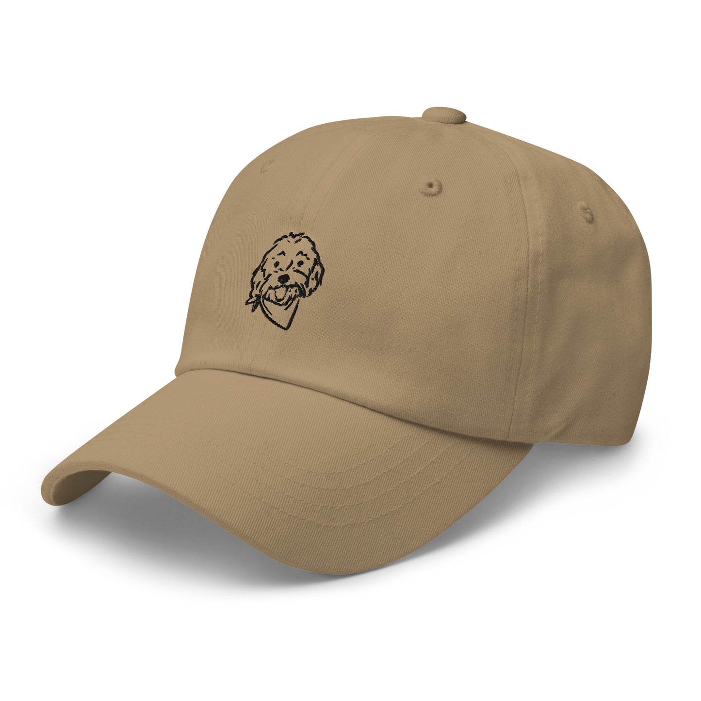 Three-quarter view of Golden Doodle hat with embroidered Doodle dog's happy face on the front of the unstructured, 6-panel, low-profile baseball style cap in khaki color with the Goldendoodle dog's face in black embroidery