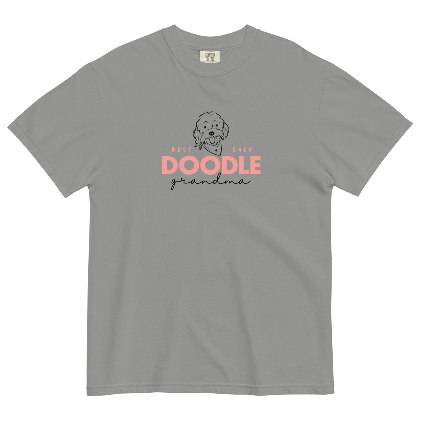 A Goldendoodle Grandma T-shirt that has a cute message, "Best EVER DOODLE Grandma" printed in soft pink and black colors with a cute Goldendoodle dog's face on the front of a cozy T-Shirt. The tag inside the Golden Doodle Grandma T-shirt says Comfort Colors