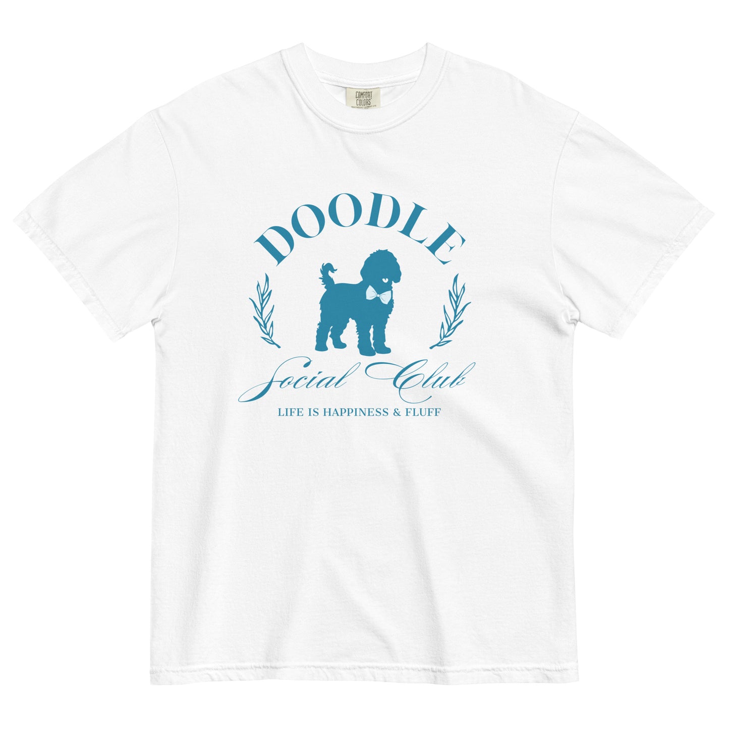 This Doodle Mom shirt displays the phrase, "Doodle Social Club" and the tag line "Live Like You're a Doodle Dog" below a graphic of a Doodle dog wearing a blue bow tie. The design is printed in light blue on the front of a white Comfort Colors short-sleeve T-shirt.