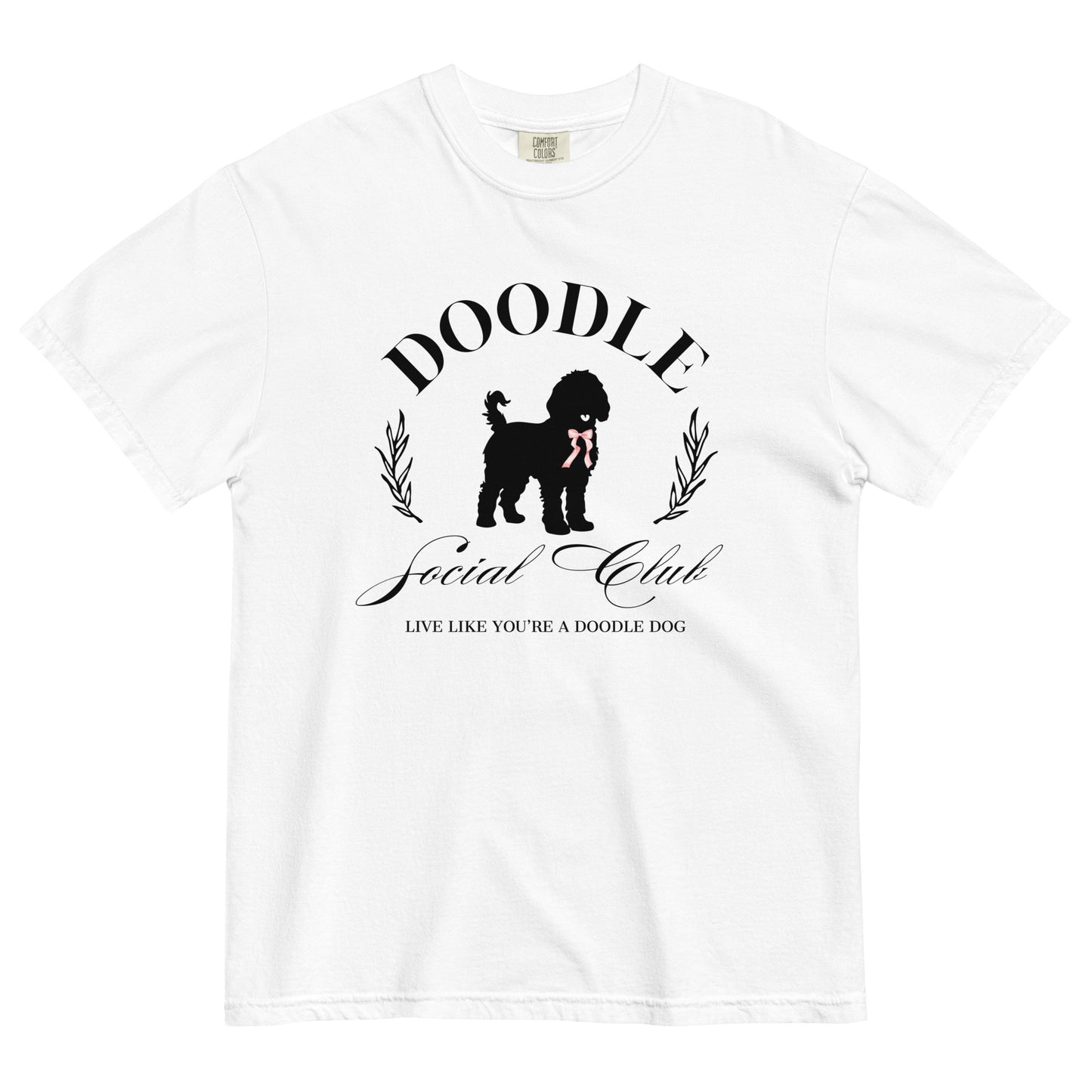 This Doodle shirt features the saying, "Doodle Social Club" and the tag line "Live Like You're a Doodle Dog" below a graphic of a Doodle dog wearing a pink ribbon around the neck. The design is printed on the front of a white Comfort Colors T-shirt.