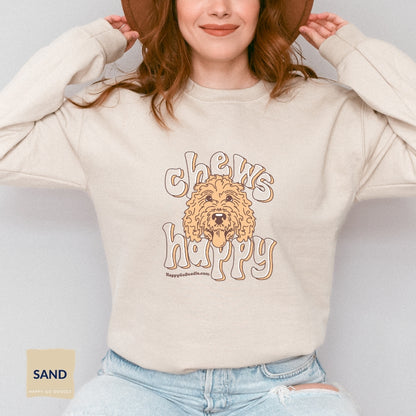 Goldendoodle crew neck sweatshirt with Goldendoodle face and words "Chews Happy" in sand  color