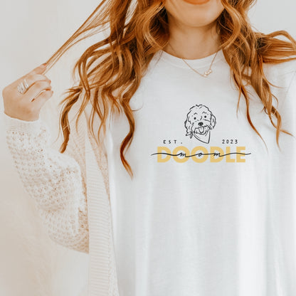 Goldendoodle Mom t-shirt with Goldendoodle face and words "Doodle Mom Est 2023" in white color