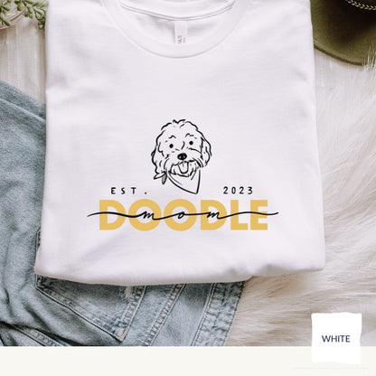 Goldendoodle Mom t-shirt with Goldendoodle face and words "Doodle Mom Est 2023" in white color