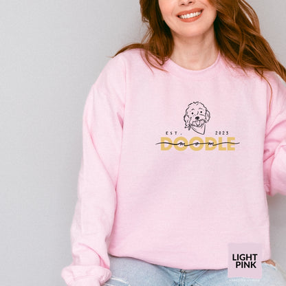 Goldendoodle Mom crew neck sweatshirt with Goldendoodle face and words "Doodle Mom Est 2023" in pink color