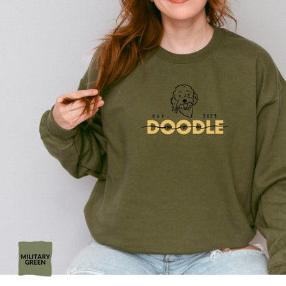 Goldendoodle Mom crew neck sweatshirt with Goldendoodle face and words "Doodle Mom Est 2023" in military green color