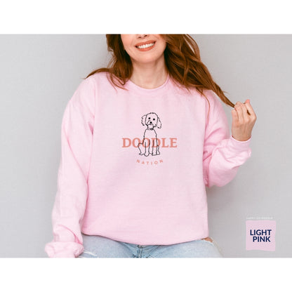 Goldendoodle crew neck sweatshirt with Goldendoodle and words "Doodle Nation" in light pink color