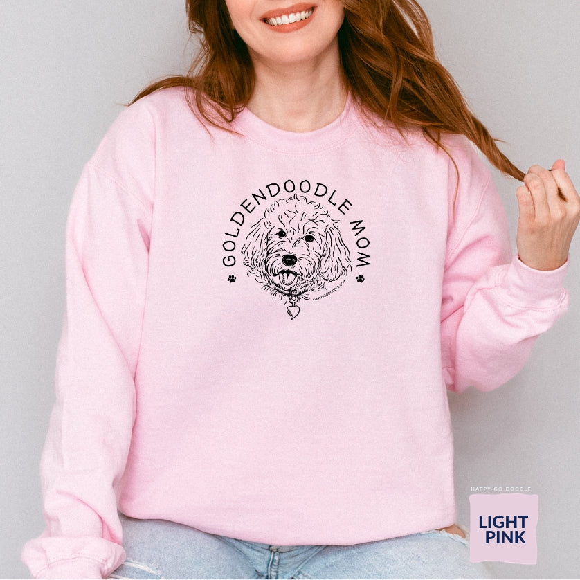 Goldendoodle crew neck sweatshirt with Goldendoodle face and words "Goldendoodle Mom" in light pink color