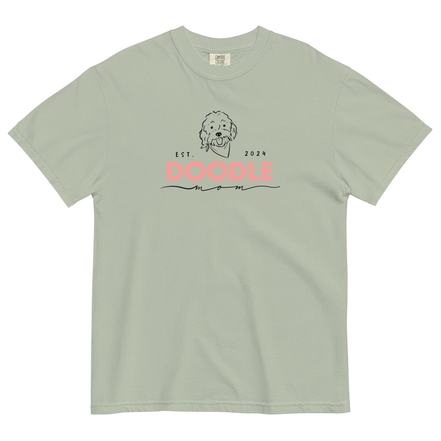 This Goldendoodle mom shirt features the message, "Doodle Mom Est. 2024" and a cute Doodle dog's face printed on the front. The tag inside the T-shirt says Comfort Colors