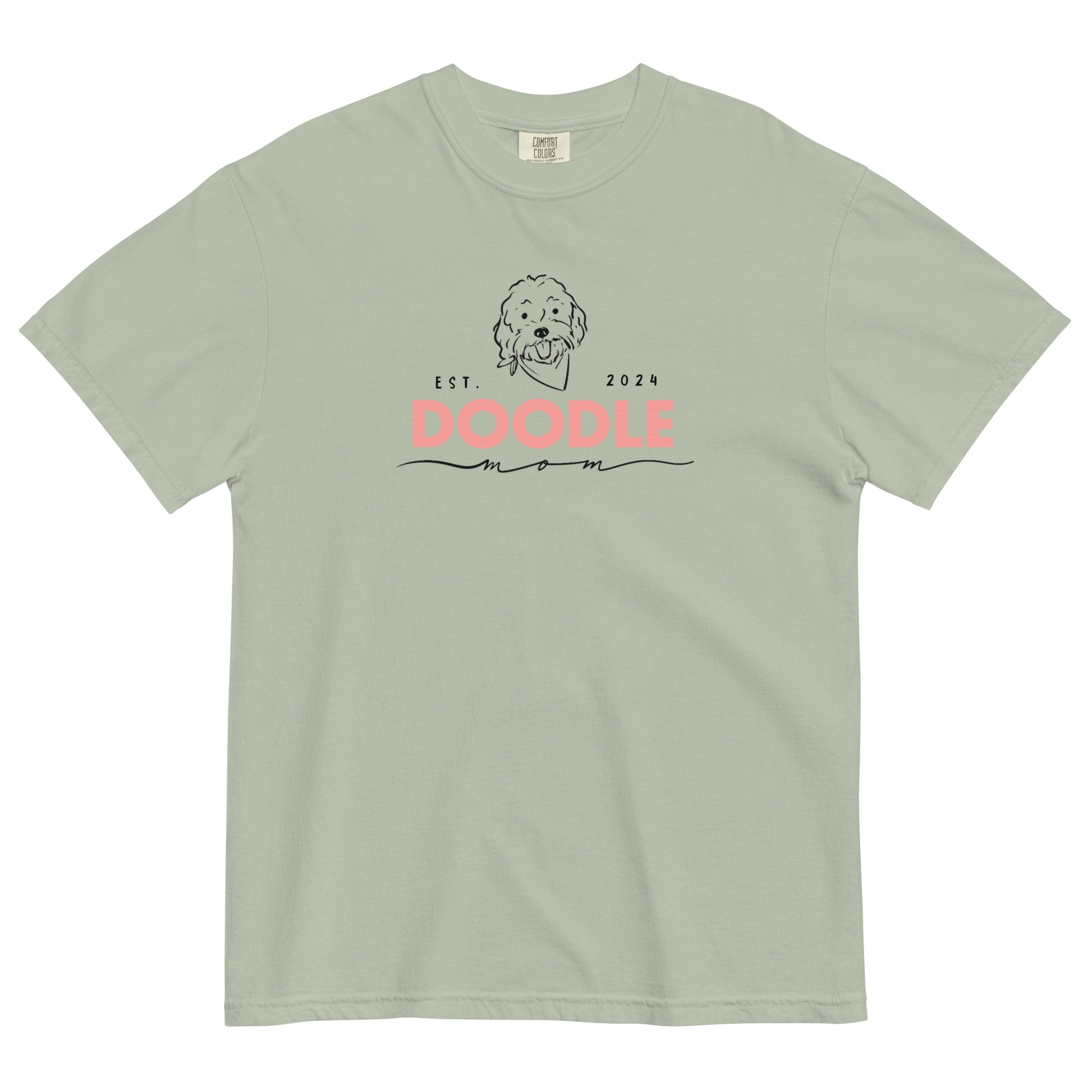 This Goldendoodle mom shirt features the message, "Doodle Mom Est. 2024" and a cute Doodle dog's face printed on the front. The tag inside the T-shirt says Comfort Colors