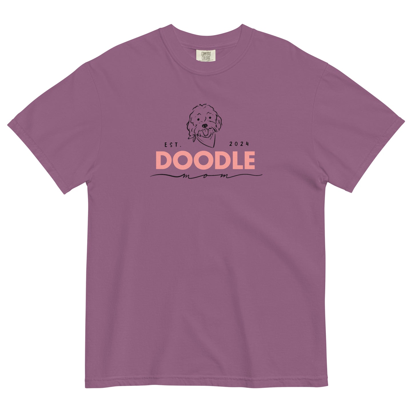 This Doodle T-shirt is berry colored and  features the message, "Doodle Mom Est. 2024" with a cute Doodle dog's face printed on the front of a cozy T-Shirt. The tag inside the shirt says Comfort Colors