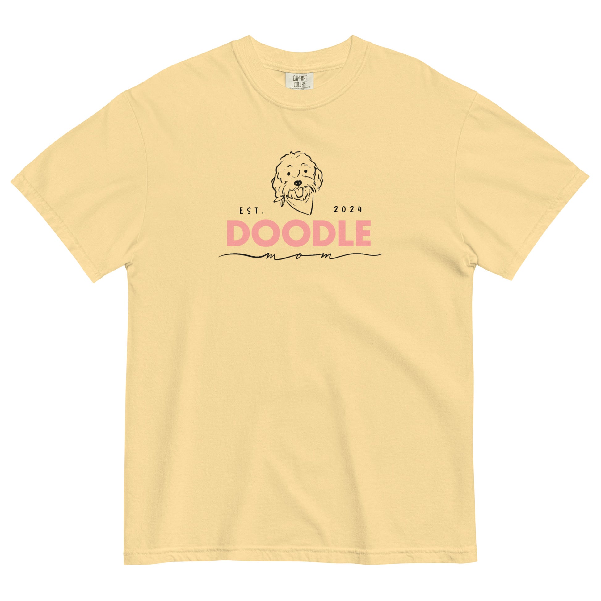 This Goldendoodle t-shirt features the phrase, "Doodle Mom Est. 2024" and a cute Doodle dog's face printed on the front of a cozy Comfort Colors shirt in butter yellow color
