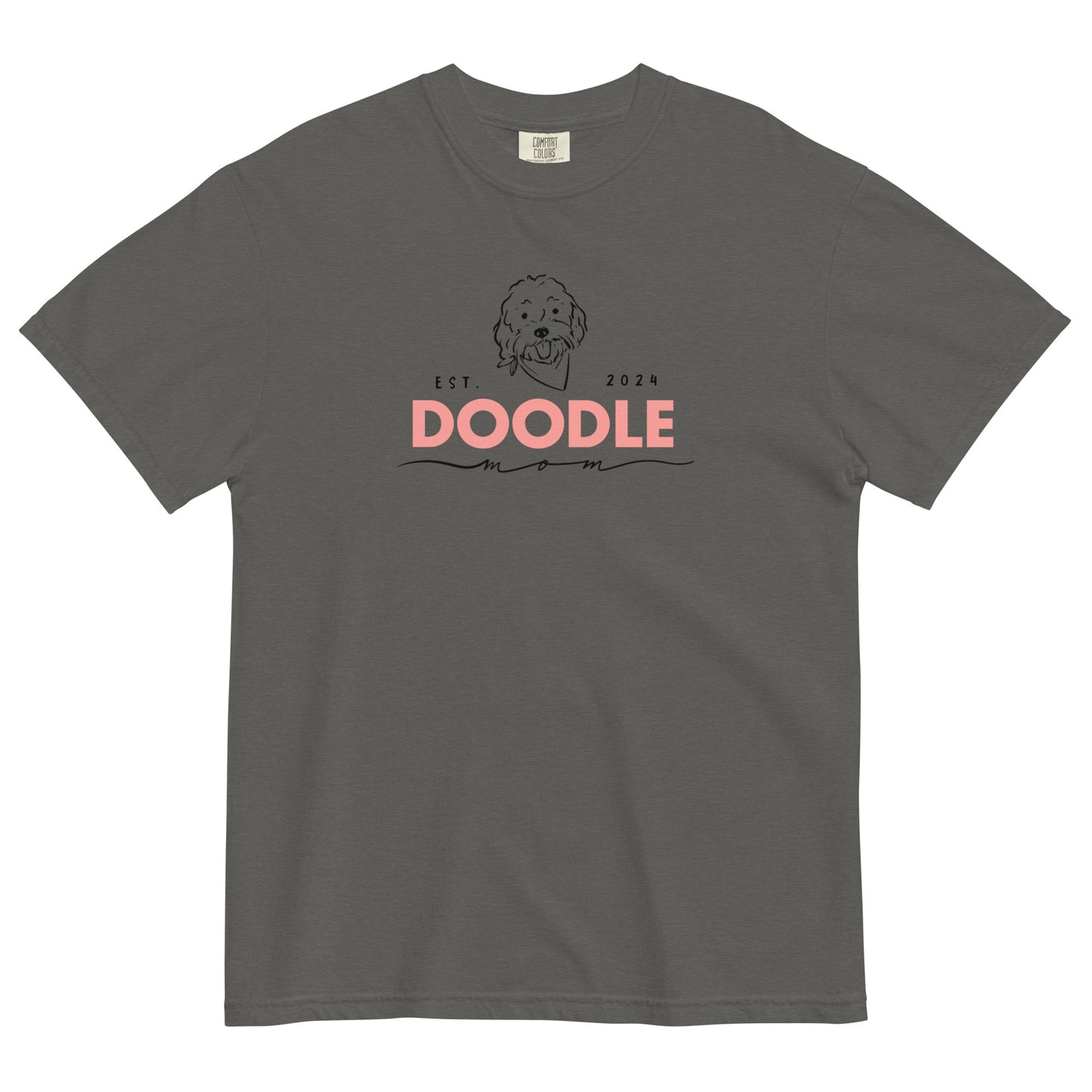 This Doodle T-shirt features the message, "Doodle Mom Est. 2024" with a cute Doodle dog's face printed on the front of a cozy Comfort Colors T-Shirt. The tag inside the shirt says Comfort Colors